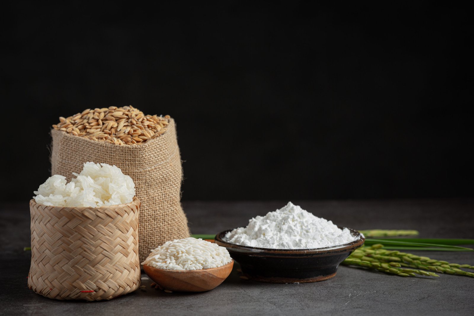 various kinds of produce from rice on dark floor